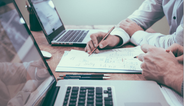 Business executives review data gleaned from radar charts